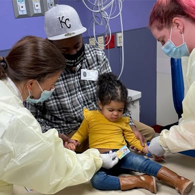 2 year-old Nora Kelley receiving a COVID-19 vaccine at Children's Mercy.