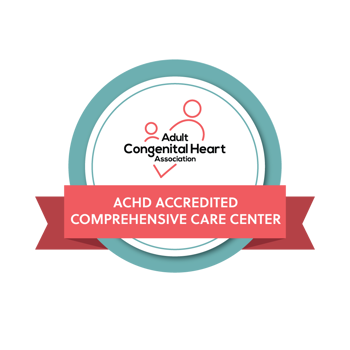 Logo of the Adult Congenital Heart Association featuring a circular badge with a teal and grey border. Inside the circle, there are three red heart-shaped figures connected by two curved lines, symbolizing a network or connection. Above this graphic, the text reads ‘Adult Congenital Heart Association’ in red, and below is a red banner with white text stating ‘ACHD ACCREDITED COMPREHENSIVE CARE CENTER.’ The overall design conveys medical professionalism and accreditation in the field of adult congenital heart care.