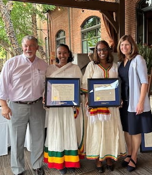 Dr. Brian Carter, (left) Neonatologist and Interim Director, Children’s Mercy Kansas City Bioethics Center, and Angela Knackstedt, (right) Director, Children’s Mercy Certificate Program in Pediatric Bioethics, present Nurse Redeat and Dr. Mahlet with their Certificates in Pediatric Bioethics.