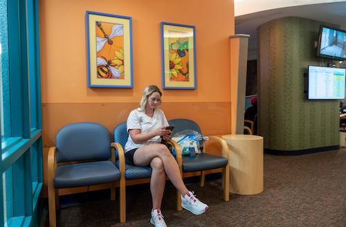 Caregiver siting in waiting room 