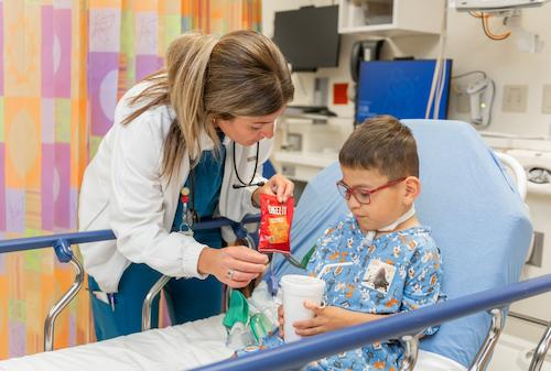 Nurse bringing patient snacks after surgery.