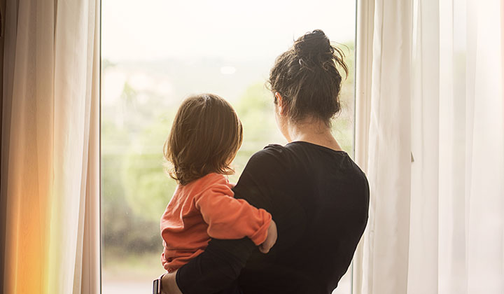 Mom and child looking out the window